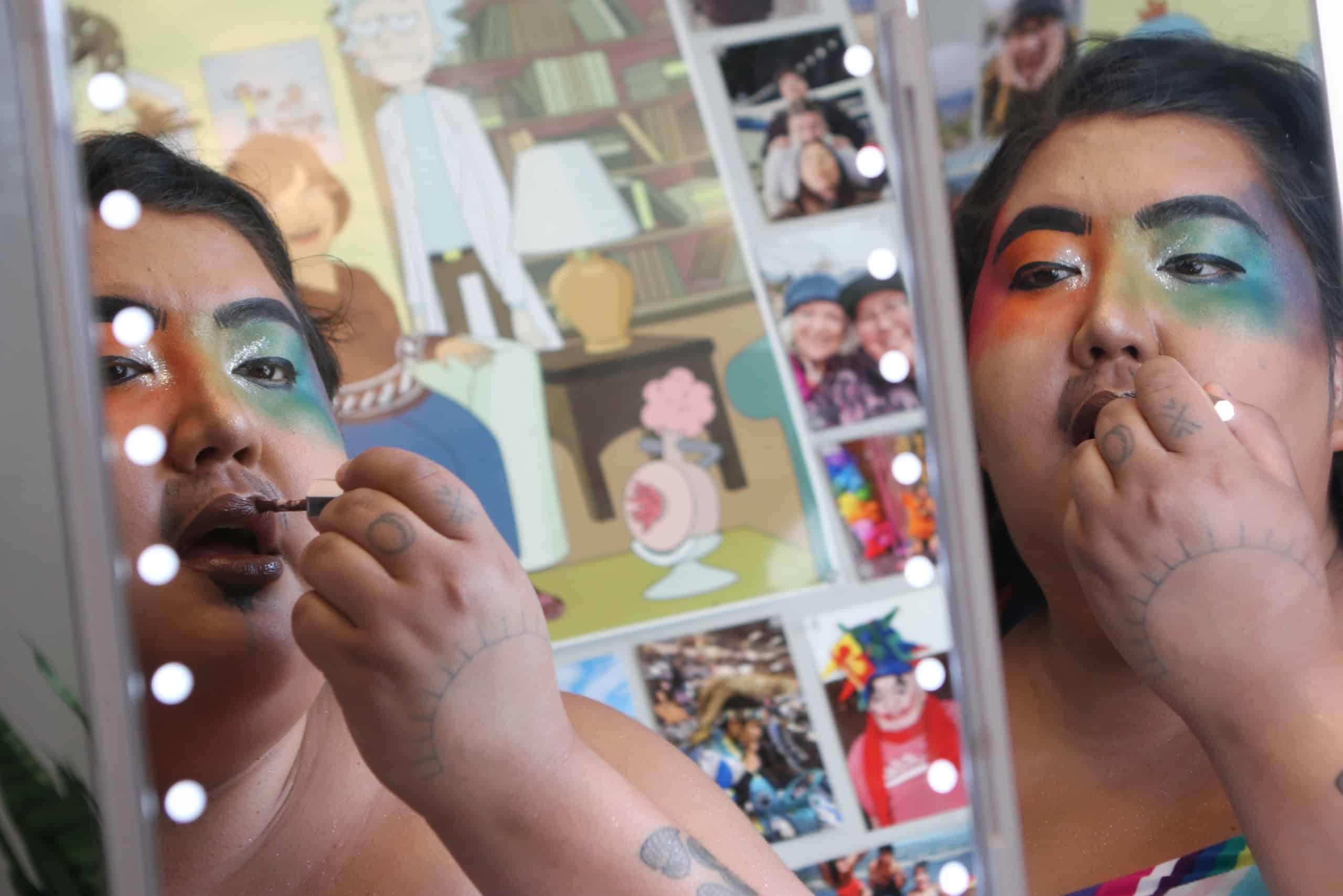 Madeline Terbasket, AKA Rez Daddy, prepares their makeup before a drag show at Brexit Pub in syilx homelands in Penticton, B.C., on June 16. Photo by Aaron Hemens
