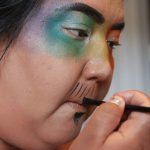 Madeline Terbasket, AKA Rez Daddy, prepares their makeup before a drag show at Brexit Pub in syilx homelands in Penticton, B.C., on June 16. Photo by Aaron Hemens