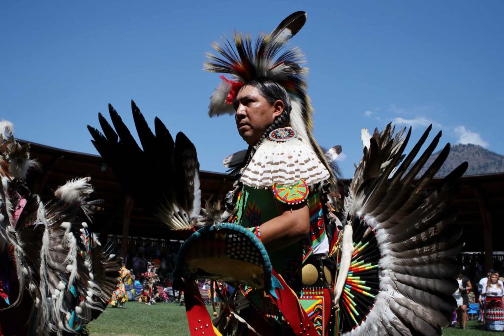A dancer participates in the grand entry of the second day of the 41st Kamloopa Powwow in Tk’emlúps (Kamloops) in Secwépemc homelands on July 30. Photo by Aaron Hemens