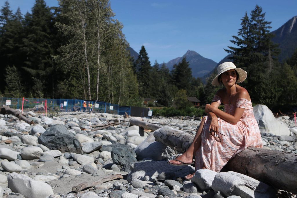 Kate Tairyan, a health sciences professor at Simon Fraser University, sits at the site of the Trans Mountain Expansion (TMX) project’s Kw'ikw'iya:la River crossing within S'olh Temexw