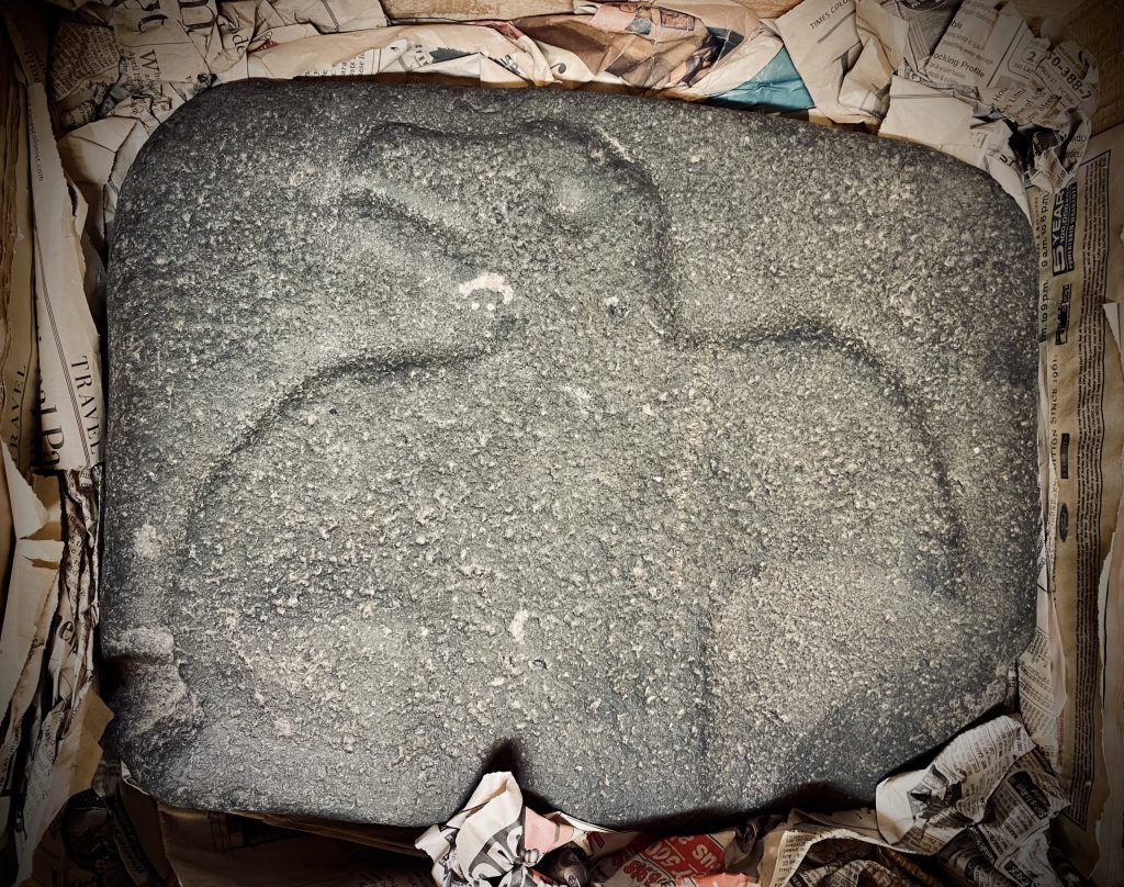 Stone carved to depict Raven