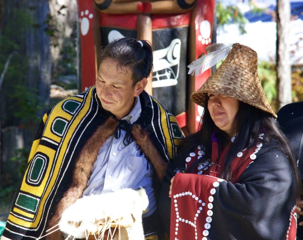 Carver Ernest Puglas with his wife, Stephanie Hanson, both wearing regalia