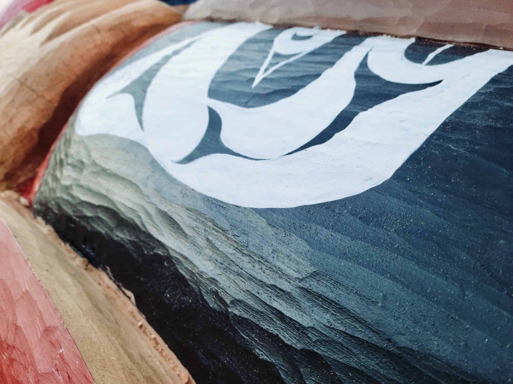 Texture of carving matches waves in waters of Squirrel Cove