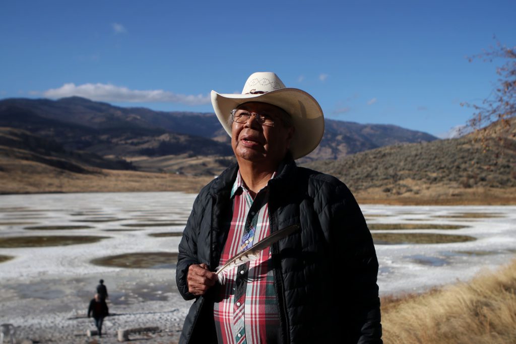 cewel’na Leon Louis of the Lower Similkameen Indian Band stands near kłlilx’w (Spotted Lake), located seven km west of sw̓iw̓s (Osoyoos) in syilx homelands, on Oct. 27. Photo by Aaron Hemens
