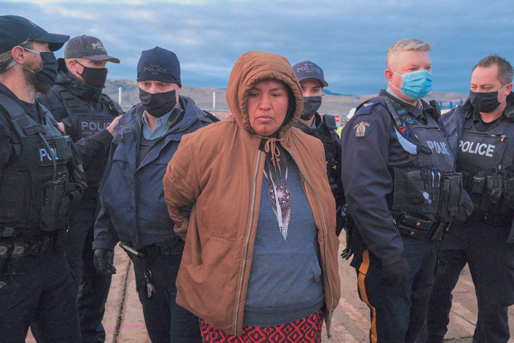 Secwépemc Matriarch Miranda Dick is arrested following a hair cutting ceremony at a TMX injunction zone in Secwépemc homelands in October 2020. (Photo: We, the Secwepemc Facebook)