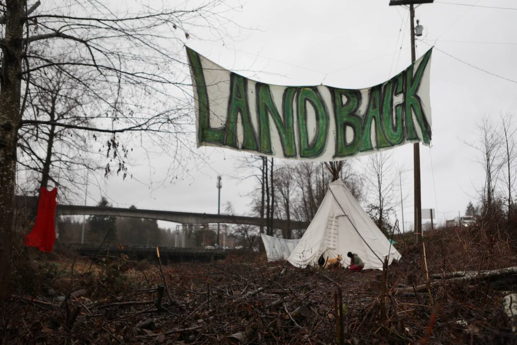 Bullock and her dog, Caly, outside of a tipi site located on the Trans Mountain Pipeline Expansion (TMX) project’s route in “Burnaby" on Jan. 21. Photo by Aaron Hemens