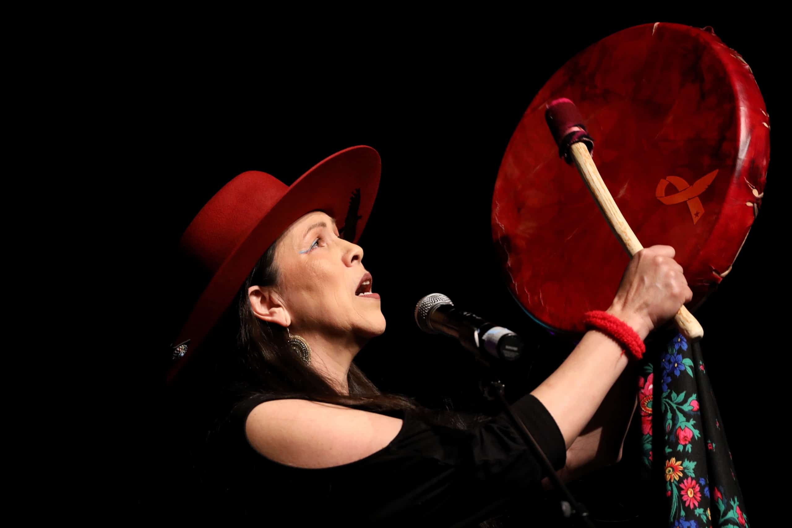 Indigenous folk artist Kym Gouchie performs at the 2023 skəlɣap Movable Feast show in snpintktn (Penticton) in syilx homelands on March 29. Photo by Aaron Hemens
