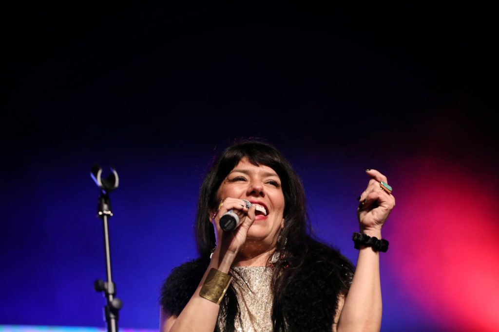 ShoShona Kish of Indigenous musical group Digging Roots performs at the 2023 skəlɣap Movable Feast show in snpintktn (Penticton) in syilx homelands on March 29. Photo by Aaron Hemens