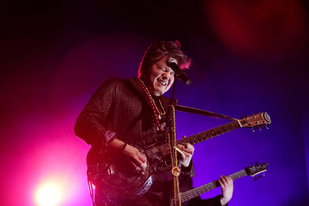 Raven Kanatakta of Indigenous musical group Digging Roots performs at the 2023 skəlɣap Movable Feast show in snpintktn (Penticton) in syilx homelands on March 29. Photo by Aaron Hemens