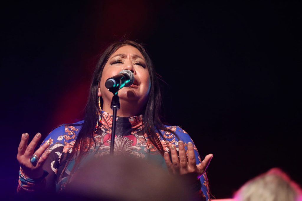 Meeka Morgan of Indigenous musical group Melawmen Collective performs at the 2023 skəlɣap Movable Feast show in snpintktn (Penticton) in syilx homelands on March 29. Photo by Aaron Hemens