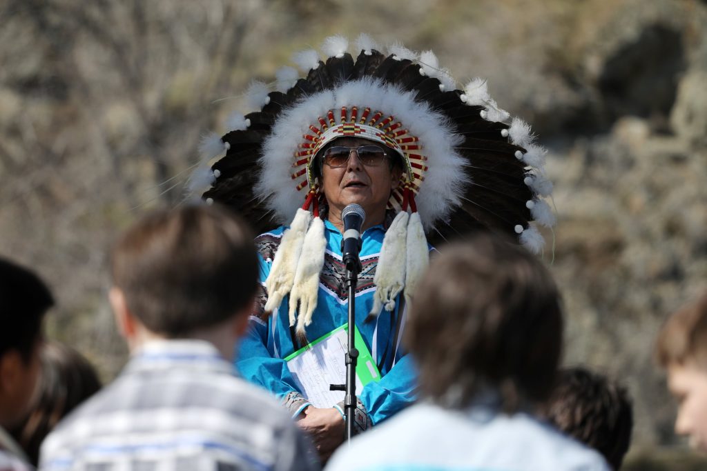 y̓ilmixʷm ki law na Chief Clarence Louie of Osoyoos Indian Band speaks in front of Youth during the band’s celebration on April 14 of a reclaimed one acre of their original reserve land. Photo by Aaron Hemens
