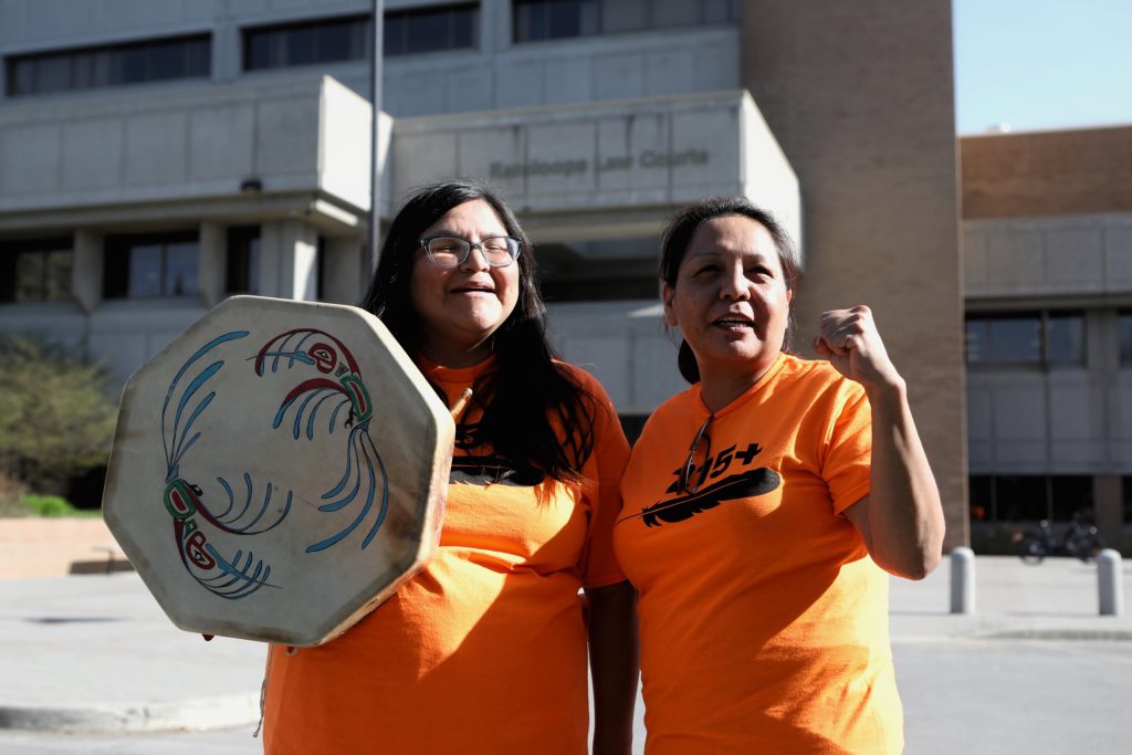 Red Deer Billie Pierre of Nlaka’pamux Nation, left, and Secwépemc Matriarch April Thomas outside of the Kamloops Law Courts building in Tk’emlúps (Kamloops) on May 2, following the second day of their sentencing hearing. The two were arrested and charged with criminal contempt for breaching a Trans Mountain Pipeline injunction-protected construction area in Secwepemcúl’ecw in October 2020. (Photo by Aaron Hemens)