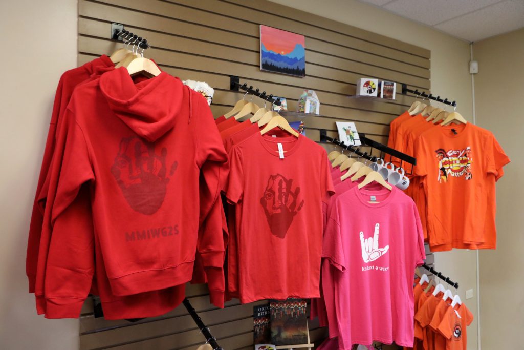 Merchandise created by Original Born Art for commemorative events such as Red Shirt Day, Pink Shirt Day and Orange Shirt Day are displayed at the Ki-Low-Na Friendship Society in syilx homelands on May 22. Photo by Aaron Hemens