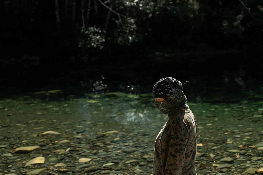 "Wee-one", an Indigenous land defender at Savage Patch camp in Pacheedaht territory near “Port Renfrew” on “Vancouver Island” on Aug. 7, 2023. Photo by Amber Bracken