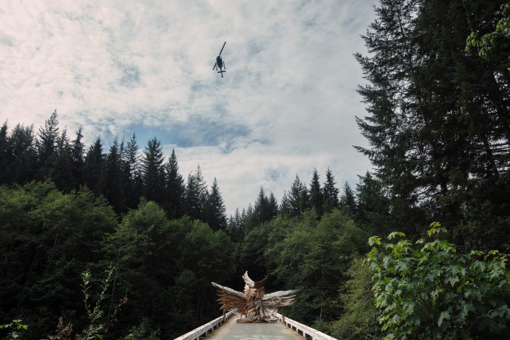 A helicopter flies very low over Savage Patch camp in Pacheedaht territory near “Port Renfrew” on “Vancouver Island” on Aug. 8, 2023. Photo by Amber Bracken