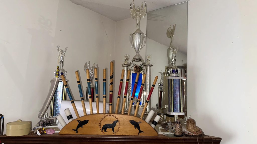 Anthony recalls where each trophy was won and points to two near the back. “I got those two trophies from Calgary and that's one of the biggest shows in the world, Calgary Stampede, so it was quite an honour to earn that.” Photo by Dionne Phillips.
