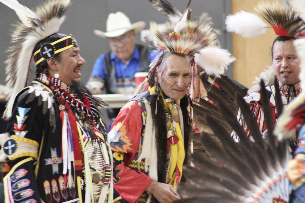 Peter Anthony, centre, dances with the winners of a men’s contest dance at the Rita Rose Anthony 2nd annual powwow. Photo by Dionne Phillips.