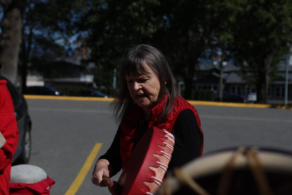 Drummers sing during a rally denouncing violence against women outside of Kamloops Courts in Secwepemcúl'ecw on June 20. Photo by Aaron Hemens
