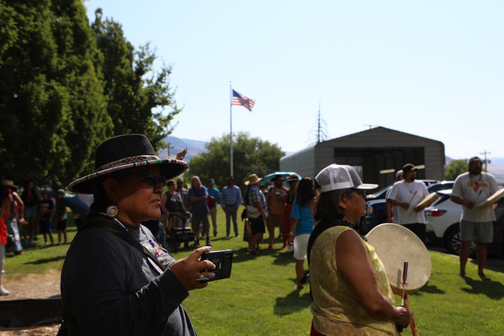 Community members wait for the arrival of horseback riders from “Canada” at the “Osoyoos-Oroville” border in syilx Okanagan homelands on July 20. Photo by Aaron Hemens