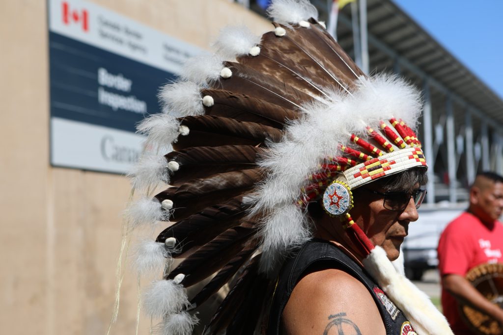 y̓ilmixʷm ki law na Clarence Louie is pictured at the “Osoyoos-Oroville” border in syilx Okanagan homelands on July 20. Photo by Aaron Hemens