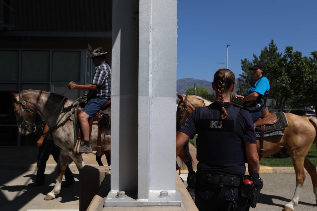 Horseback riders make their way back into “Canada” from the “U.S.” at the “Osoyoos-Oroville” border in syilx Okanagan homelands on July 20. Photo by Aaron Hemens