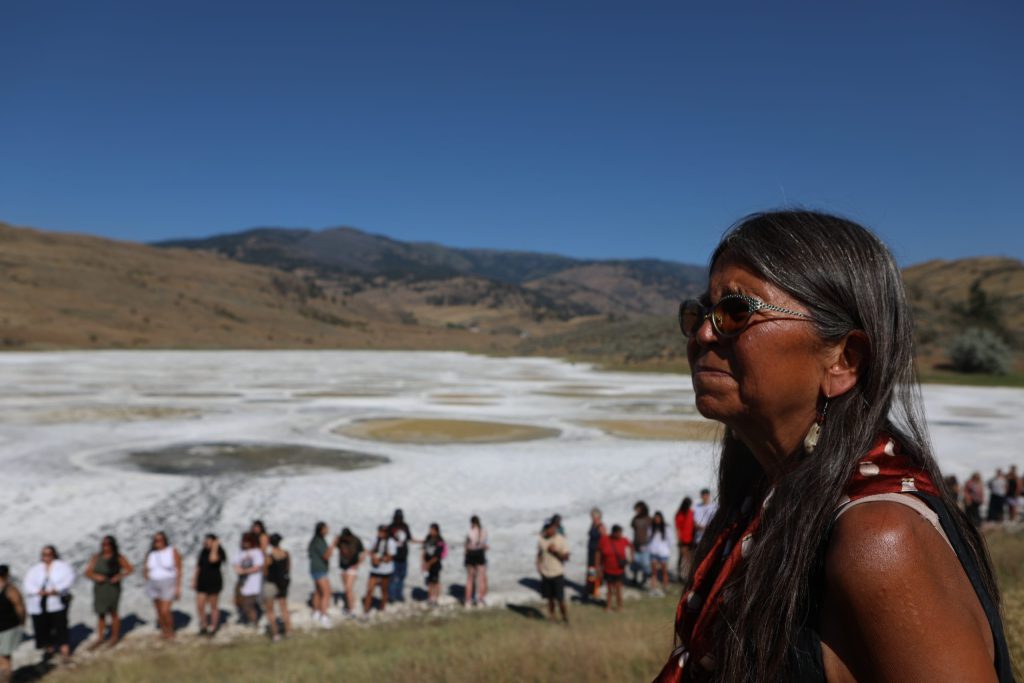 suiki?st Pauline Terbasket, the executive director of the Okanagan Nation Alliance, listens to remarks during the opening ceremony of the nation’s annual general assembly and Youth leadership summit at kłlilx’w (Spotted Lake) in sw̓iw̓s (Osoyoos) in syilx Okangan homelands on July 24. Photo by Aaron Hemens