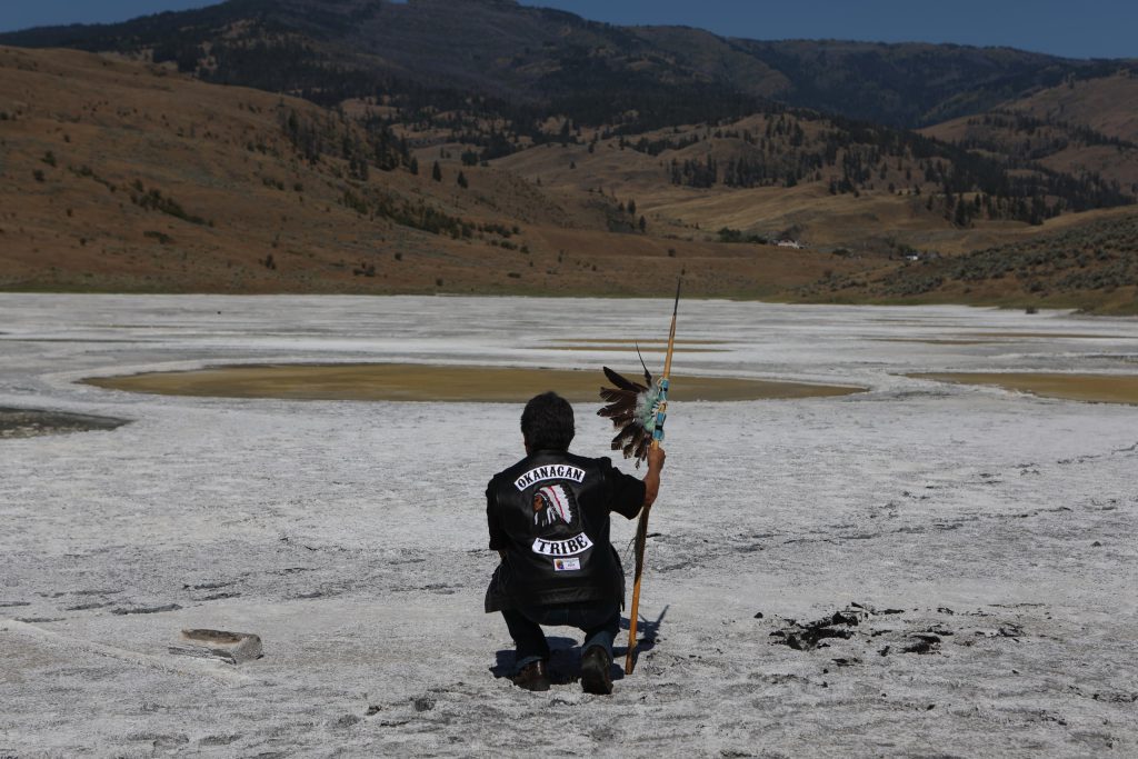 Chief Clarence Louie of Osoyoos Indian Band stands in kłlilx’w (Spotted Lake) following the opening ceremony of the nation’s annual general assembly and Youth leadership summit in sw̓iw̓s (Osoyoos) in syilx Okangan homelands on July 24. Photo by Aaron Hemens