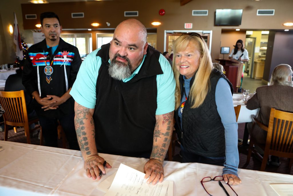 Lower Similkameen Indian Band Chief kalʔlùpaɋʹn Keith Crow, left, poses with Bonnie Jacobsen — Chief of Upper Similkameen Band — while signing the memorandum of agreement (MOA) at the Penticton Golf and Country Club in syilx Okanagan territory on Nov. 15, 2024. Photo by Aaron Hemens