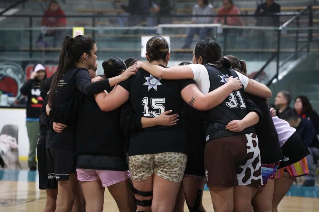The Similkameen Starbirds huddle before their game against the Hazelton Mystics onFeb. 13, during the 65th annual All Native Basketball Tournament. Photo by Aaron Hemens