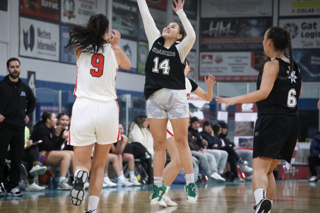 Similkameen Starbirds' player Teigan Peterson Terbasket attempts a steal against the Hazelton Mystics during their game on Feb. 13, for the 65th annual All Native Basketball Tournament. Photo by Aaron Hemens