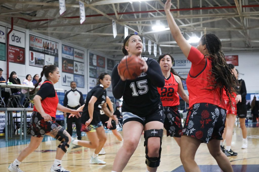 Similkameen Starbirds' player Madison Terbasket attempts a shot against Vancouver's All My Relations during their game on Feb. 13, for the 65th annual All Native Basketball Tournament. Photo by Aaron Hemens