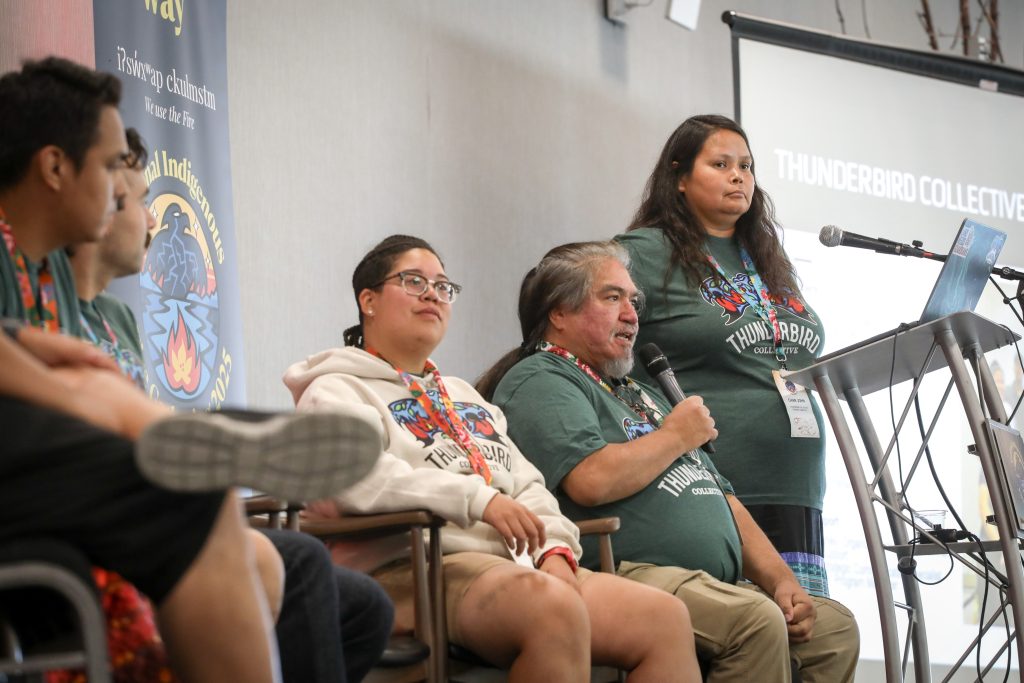 Joe Gilchrist (second from right), vice-chair of the Thunderbird Collective’s steering committee, speaks at the inaugural National Indigenous Fire Gathering in snpink’tn (Penticton) in syilx homelands on Sept. 23. Photo by Aaron Hemens