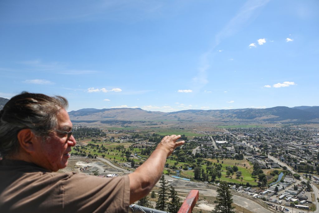 Joe Gilchrist gestures south towards the City of Merritt on July 16, where he grew up and learned to be a firekeeper. Photo by Aaron Hemens