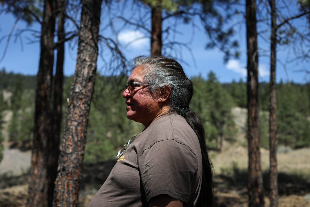 Joe Gilchrist stands in an area in the northern part of ‘Merritt’ that he treated with fire more than a decade ago. Since then, more natural fuel has accumulated on the ground, increasing wildfire risk. Photo by Aaron Hemens