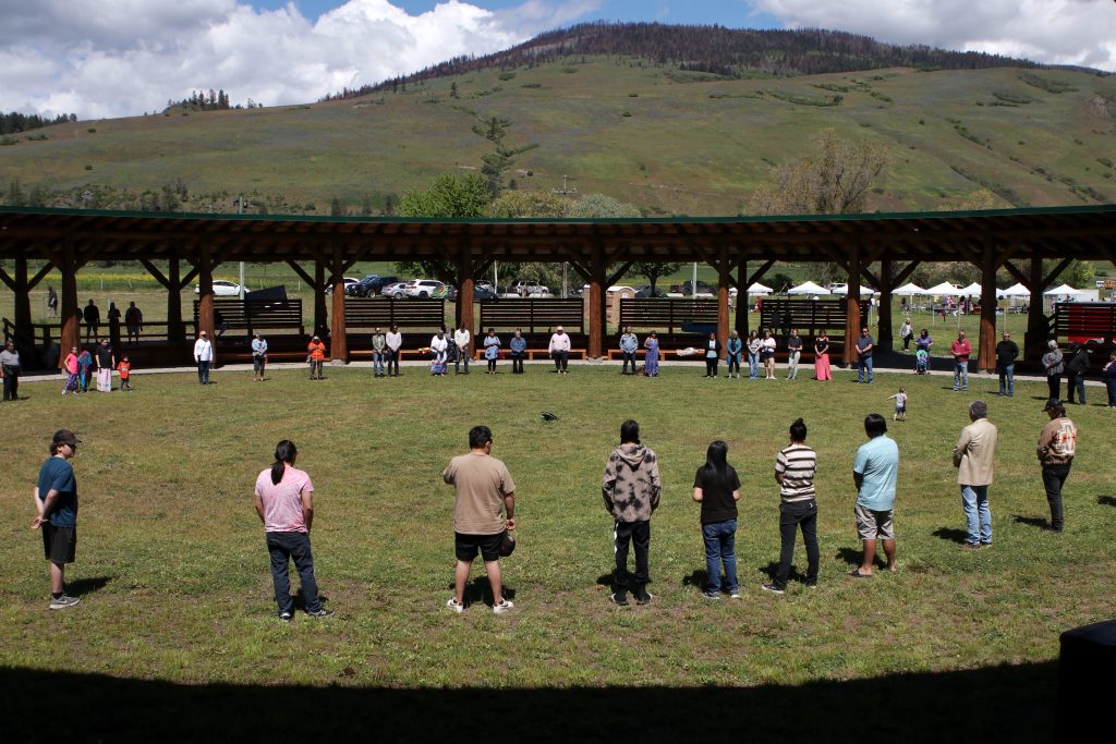 Members of the Okanagan Indian Band gather in a circle during the re-opening of the community’s Cultural Arbor in 2022. Photo by Aaron Hemens