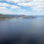 An aerial view of kɬúsx̌nítkʷ (Okanagan Lake) in syilx territory, from May 14, 2026. Photo by Aaron Hemens