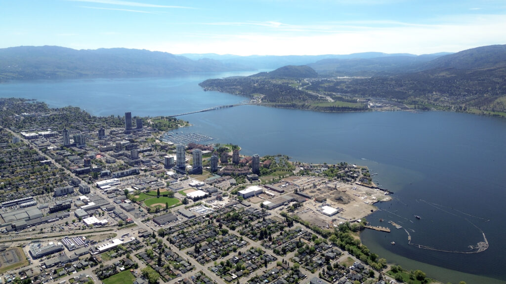 The Regional District of Central Okanagan, in syilx territory, is seen in a 2025 aerial photo. In the foreground is the kiʔláwnaʔ (Kelowna), with Westbank First Nation and the City of West Kelowna in the background. Photo by Aaron Hemens