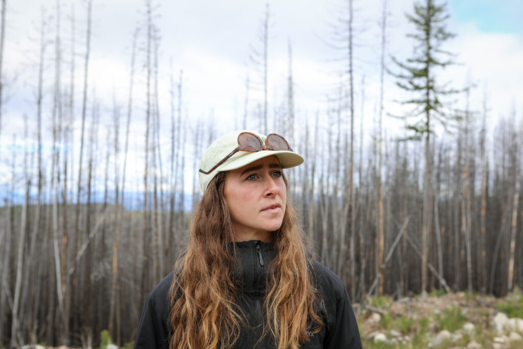 Eden Hardcastle, a forester-in-training with Nk’Mip Forestry, is pictured on June 10, 2026, at the site of a wildfire restoration project that she is leading on Osoyoos Indian Band homelands. Photo by Aaron Hemens