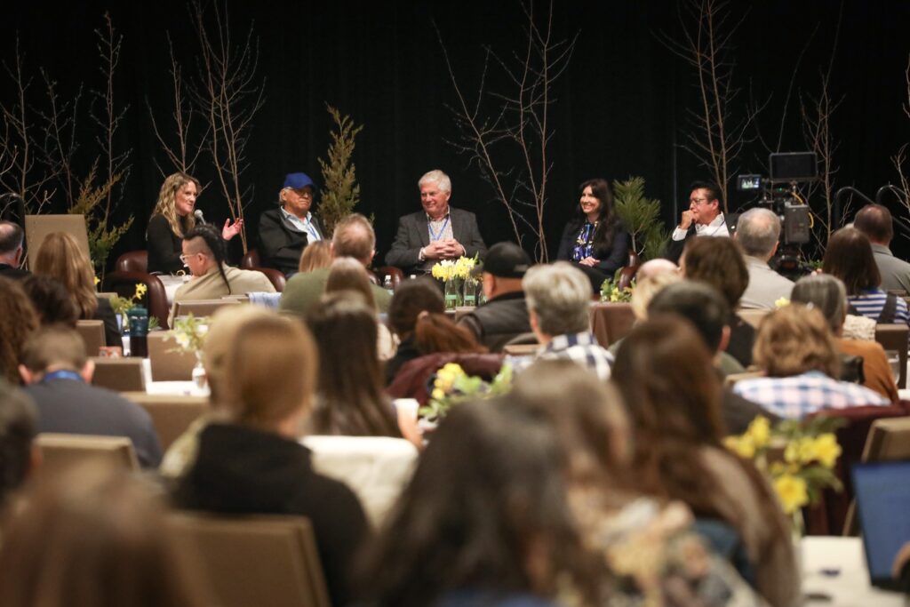 Members of the Okanagan-Similkameen Collaborative Leadership Table participate a panel discussion at the Okanagan Nation Alliance's 2026 siwɬkʷ (Water) and Climate Forum on March 23 in Kelowna, B.C. From left to right: Tricia Brett, leadership table co-chair and councillor for the District of Lake Country; sil-teekin Greg Gabriel, chief of Penticton Indian Band; Julius Bloomfield, mayor of Penticton; Amanda Shatzko, director of Regional District North Okanagan; and simo Robert Louie, leadership table co-chair and chief of Westbank First Nation. Photo by Aaron Hemens